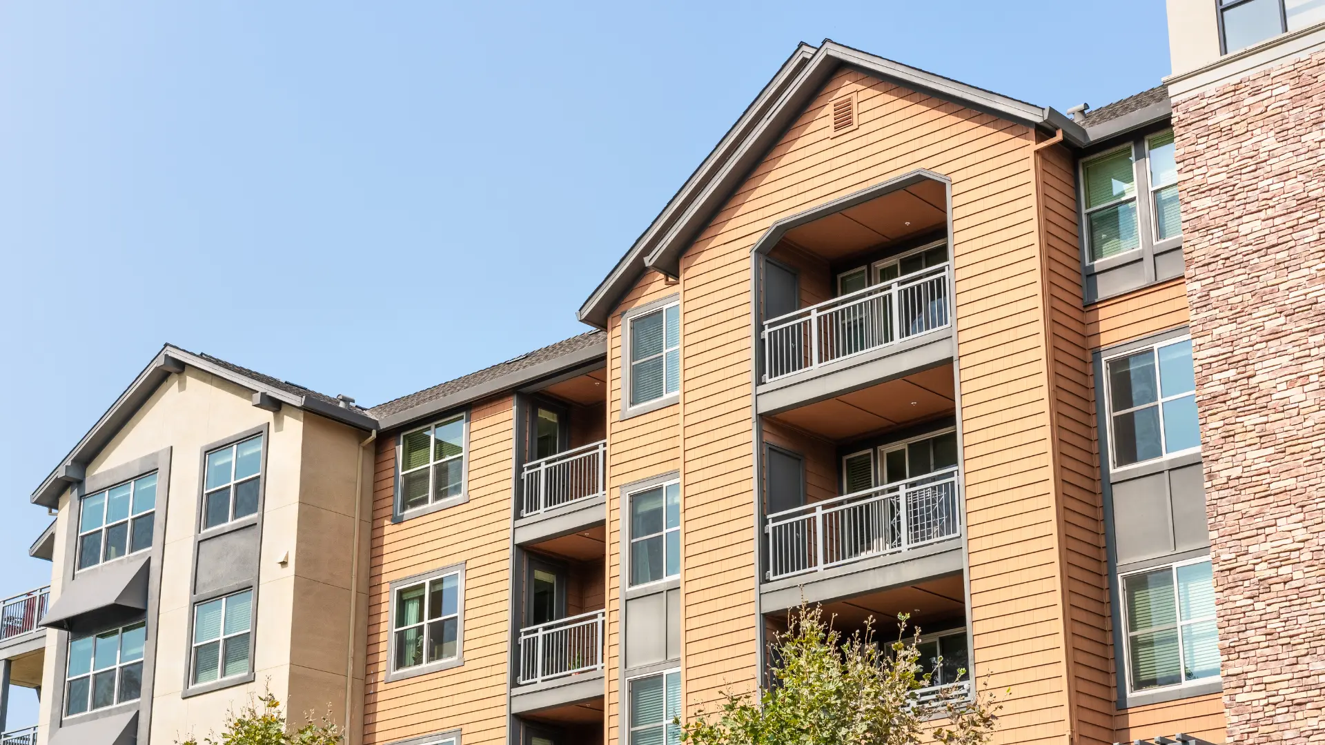 Row of NSPIRE-compliant multi-family apartments that passed inspection successfully.