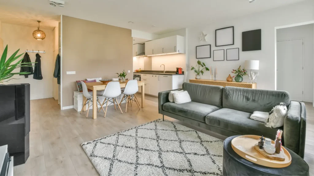 Stylish apartment living room with soft decorative sofa, showcasing modern interior design