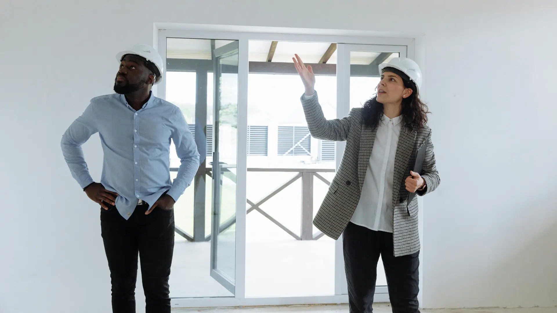 Inspector and property owner reviewing unit during pre NSPIRE inspection walkthrough