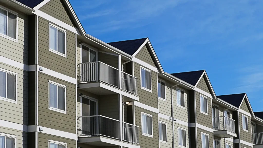 Modern multifamily apartment complex with new siding and balcony upgrades