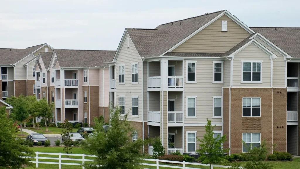 Modern multifamily apartment complex with well-maintained landscaping and exteriors