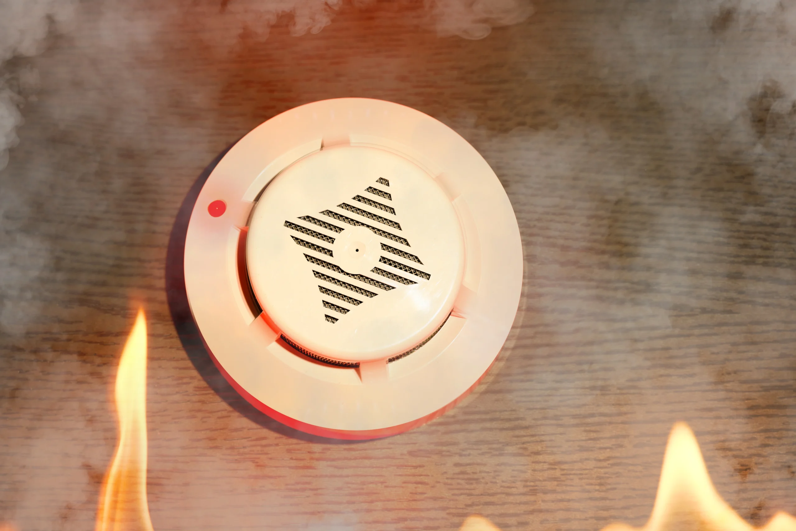 Smoke detector activating during fire, illustrating HUD requirements under NSPIRE