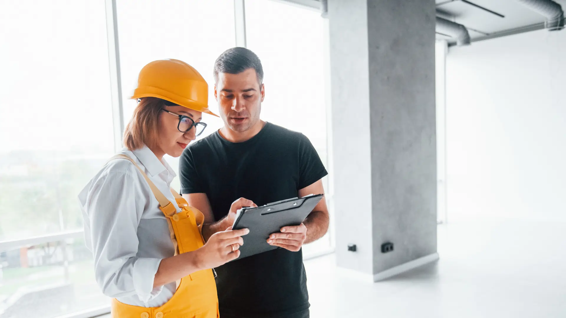 Inspector reviewing NSPIRE compliance checklist during HUD property evaluation