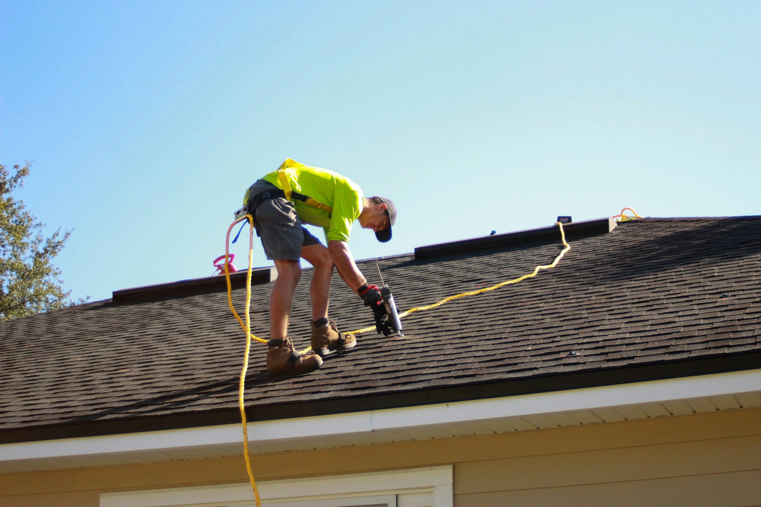 nspire-property-maintenance-tips Technician repairing a roof as part of NSPIRE Property Maintenance and inspection prep