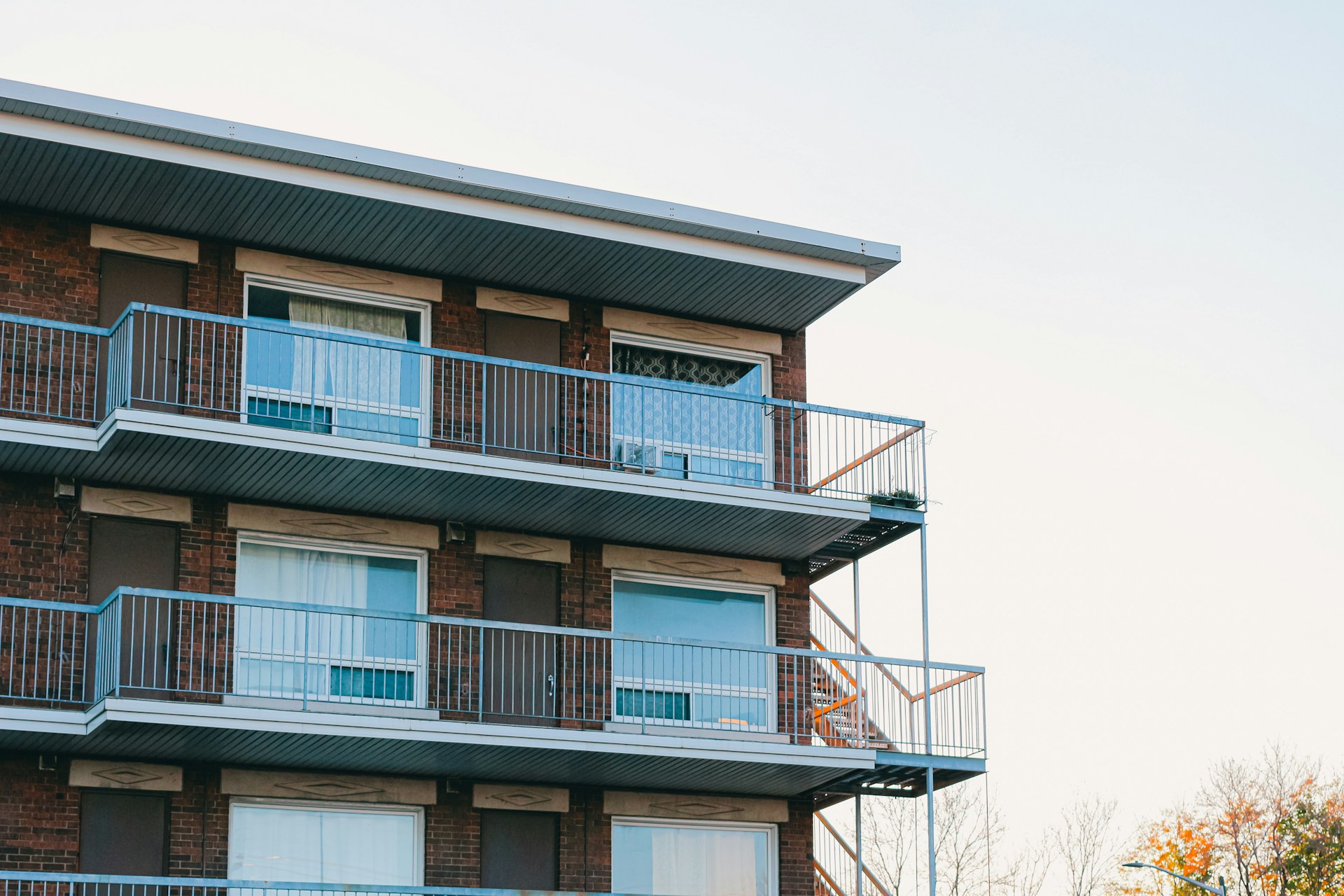 public-housing-nspire-inspections Exterior view of a brick apartment building undergoing a public housing inspection.