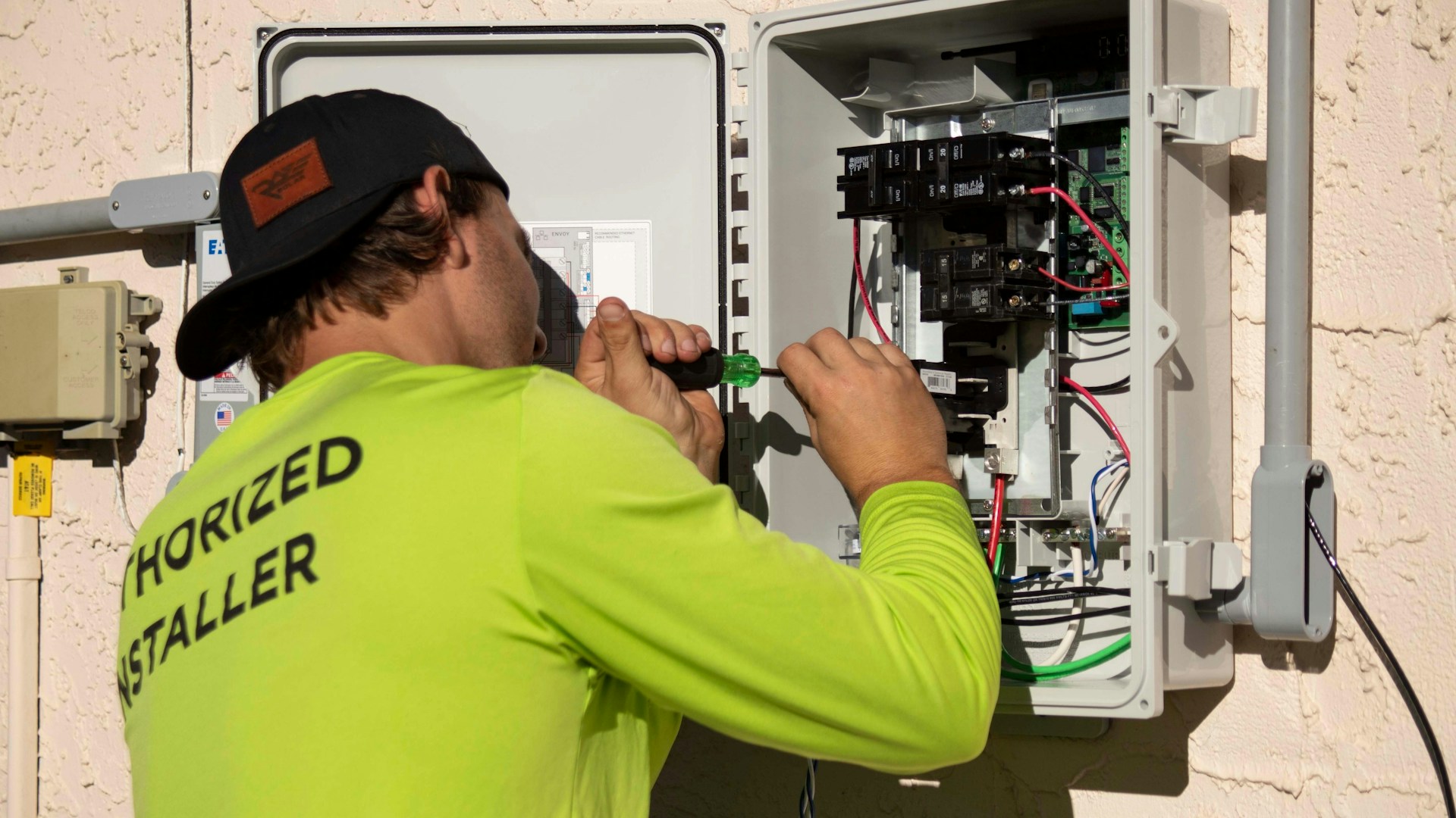 NSPIRE Electrical Inspection Technician checking electrical panel during NSPIRE Electrical Inspection for HUD compliance